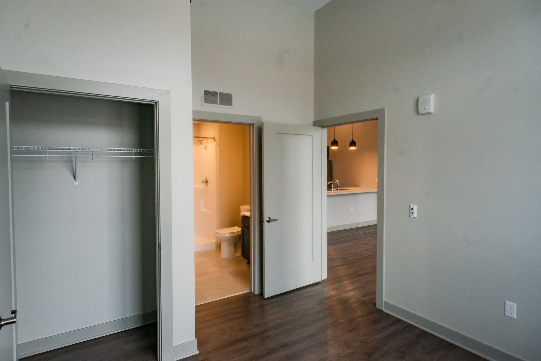 bedroom with white walls and greige trim